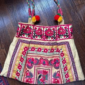 Large hand embroidered bag with red & pink blossoms; made in Thailand.